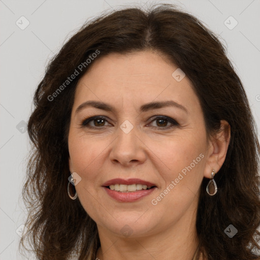 Joyful white adult female with long  brown hair and brown eyes