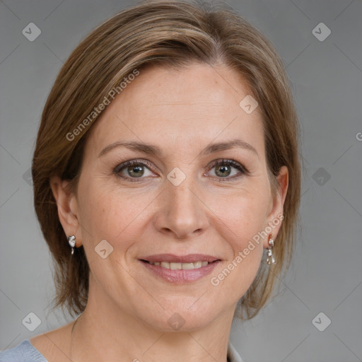 Joyful white adult female with medium  brown hair and grey eyes