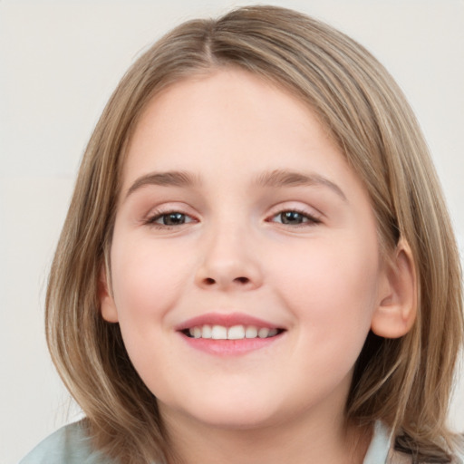 Joyful white child female with medium  brown hair and grey eyes