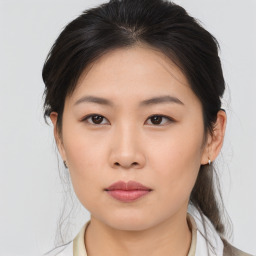 Neutral asian young-adult female with medium  brown hair and brown eyes