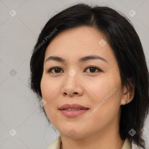 Joyful asian young-adult female with medium  brown hair and brown eyes