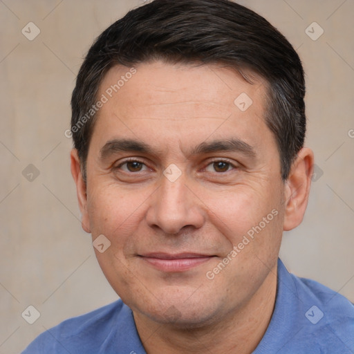 Joyful white adult male with short  black hair and brown eyes