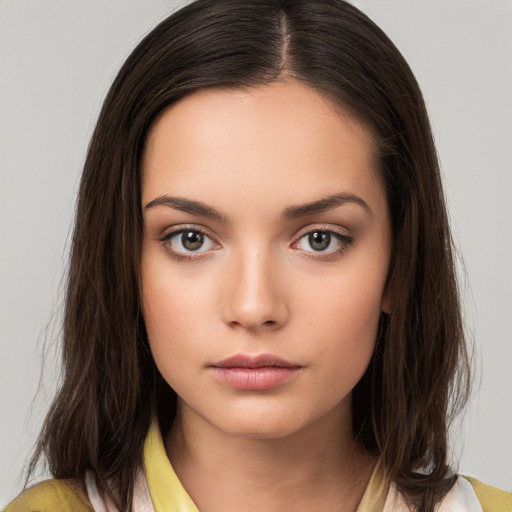 Neutral white young-adult female with medium  brown hair and brown eyes