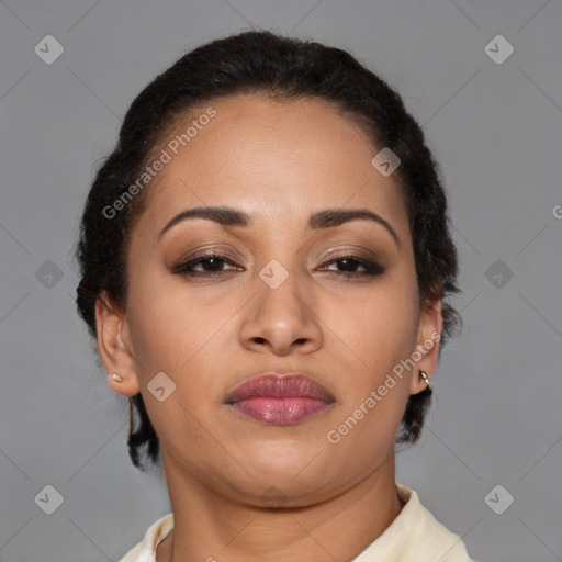 Joyful latino young-adult female with short  brown hair and brown eyes