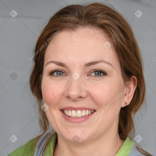 Joyful white young-adult female with medium  brown hair and blue eyes