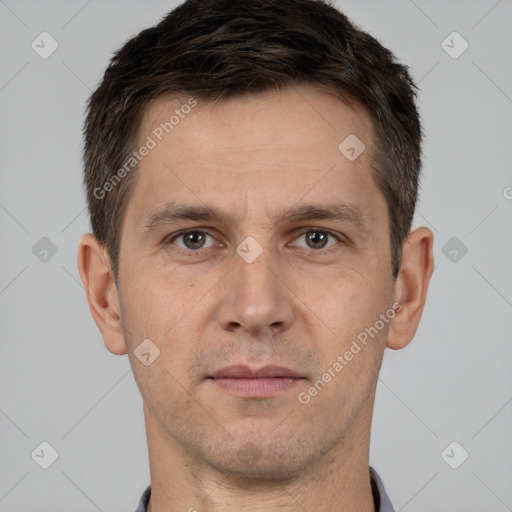 Joyful white adult male with short  brown hair and brown eyes