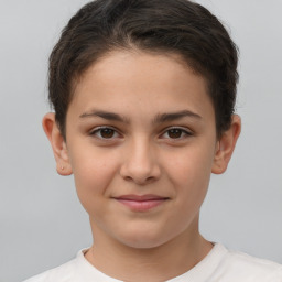 Joyful white child female with short  brown hair and brown eyes