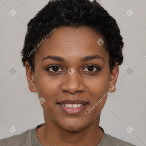 Joyful black young-adult female with short  black hair and brown eyes