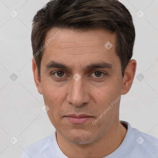 Joyful white adult male with short  brown hair and brown eyes