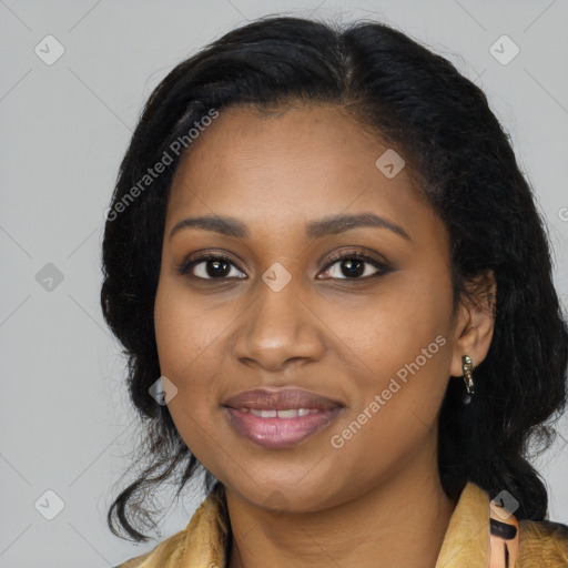 Joyful black young-adult female with long  black hair and brown eyes