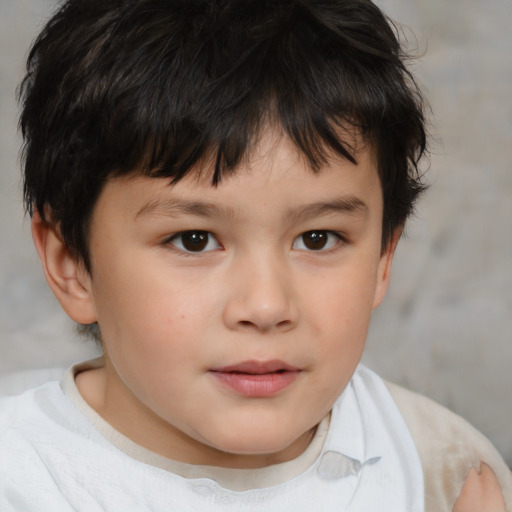 Joyful white child male with short  brown hair and brown eyes