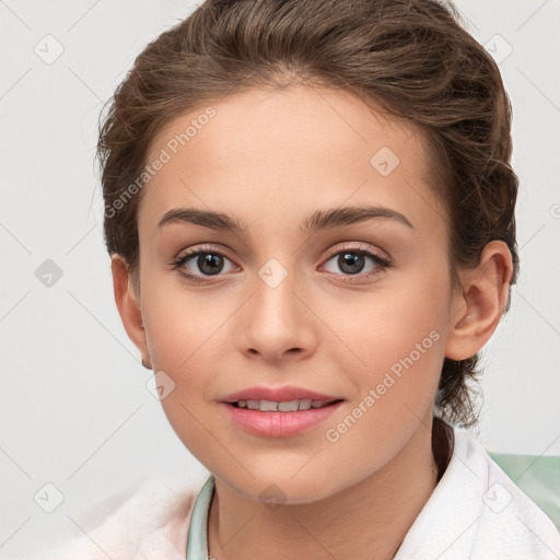 Joyful white child female with short  brown hair and brown eyes