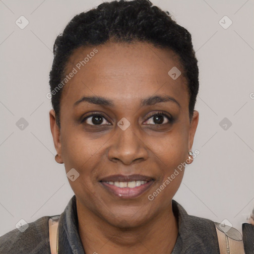 Joyful black young-adult female with short  black hair and brown eyes