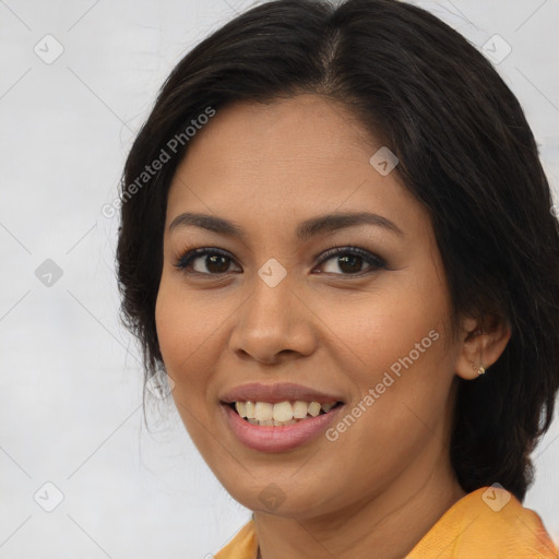 Joyful latino young-adult female with long  brown hair and brown eyes