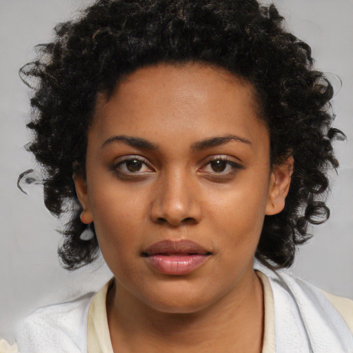 Neutral black young-adult female with short  brown hair and brown eyes