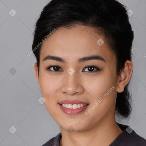 Joyful white young-adult female with short  black hair and brown eyes