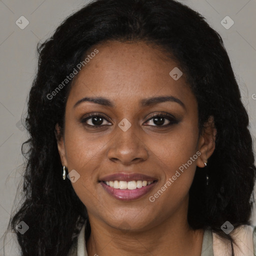 Joyful black young-adult female with long  brown hair and brown eyes