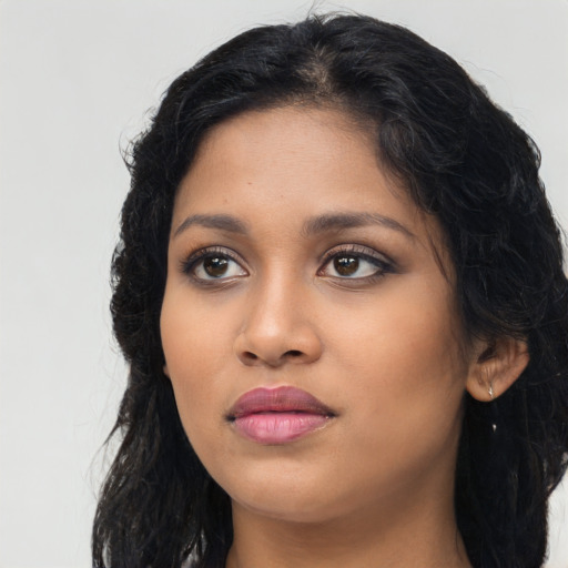 Neutral latino young-adult female with long  black hair and brown eyes