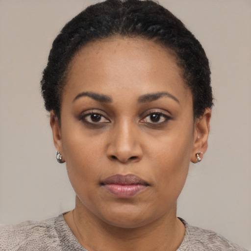 Neutral black young-adult female with short  black hair and brown eyes