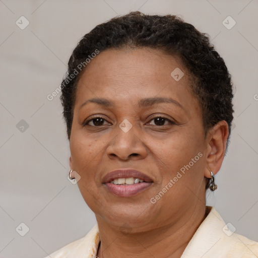 Joyful latino adult female with short  brown hair and brown eyes