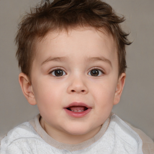 Joyful white child male with short  brown hair and brown eyes