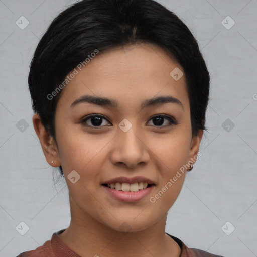 Joyful asian young-adult female with short  black hair and brown eyes