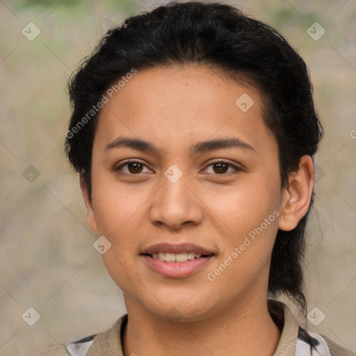 Joyful latino young-adult female with short  brown hair and brown eyes