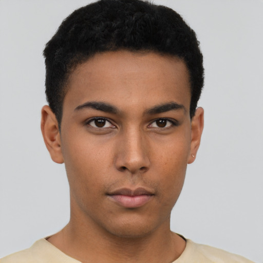 Neutral latino young-adult male with short  brown hair and brown eyes