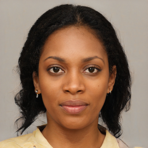 Neutral black young-adult female with medium  black hair and brown eyes