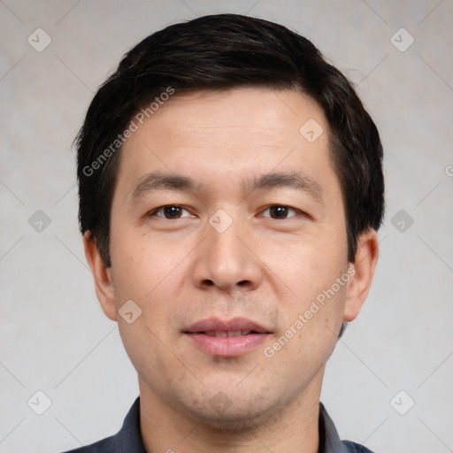 Joyful white young-adult male with short  black hair and brown eyes