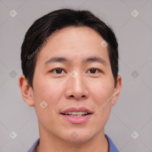 Joyful asian young-adult male with short  brown hair and brown eyes