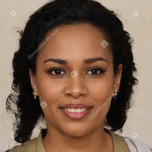 Joyful black young-adult female with long  brown hair and brown eyes