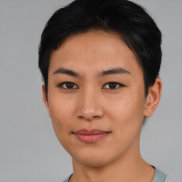 Joyful asian young-adult female with short  black hair and brown eyes