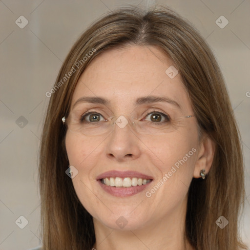 Joyful white adult female with long  brown hair and brown eyes