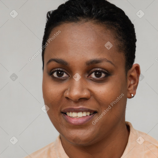 Joyful black young-adult female with short  black hair and brown eyes