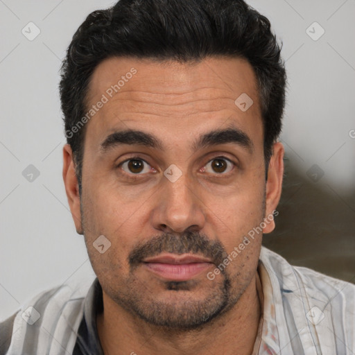 Joyful white adult male with short  black hair and brown eyes