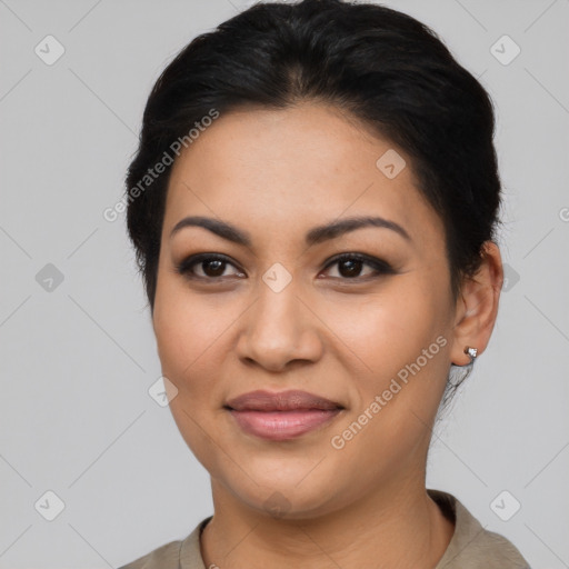 Joyful latino young-adult female with short  black hair and brown eyes