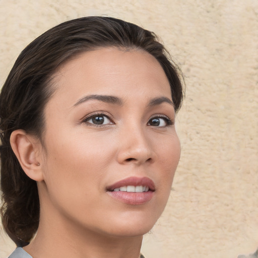 Joyful white young-adult female with medium  brown hair and brown eyes