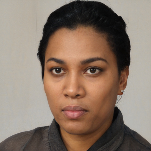 Neutral latino young-adult female with short  black hair and brown eyes