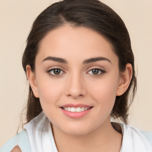 Joyful white young-adult female with medium  brown hair and brown eyes