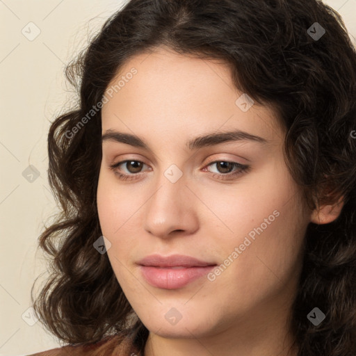 Neutral white young-adult female with long  brown hair and brown eyes