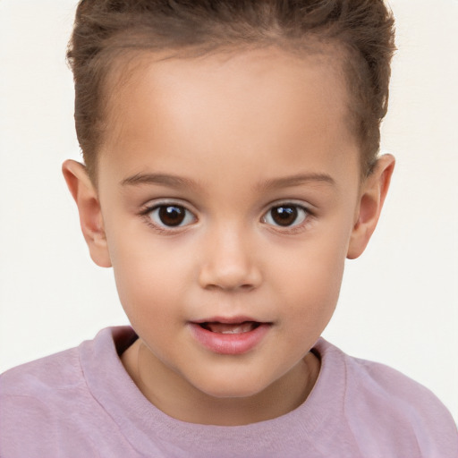 Joyful white child female with short  brown hair and brown eyes