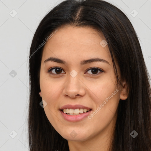 Joyful latino young-adult female with long  brown hair and brown eyes