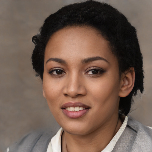 Joyful latino young-adult female with short  black hair and brown eyes