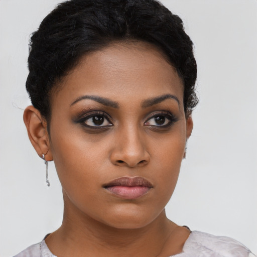 Neutral black young-adult female with short  brown hair and brown eyes