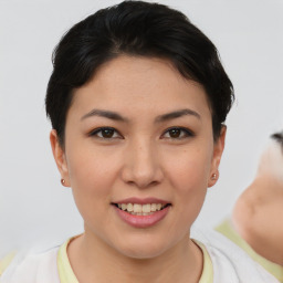 Joyful asian young-adult female with short  brown hair and brown eyes