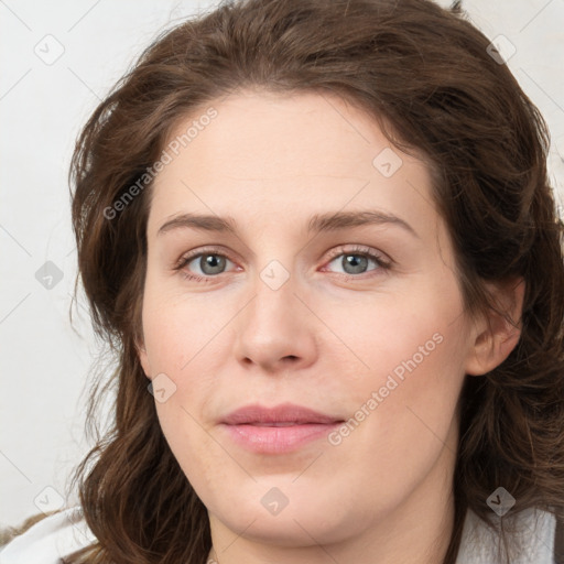 Joyful white young-adult female with medium  brown hair and green eyes