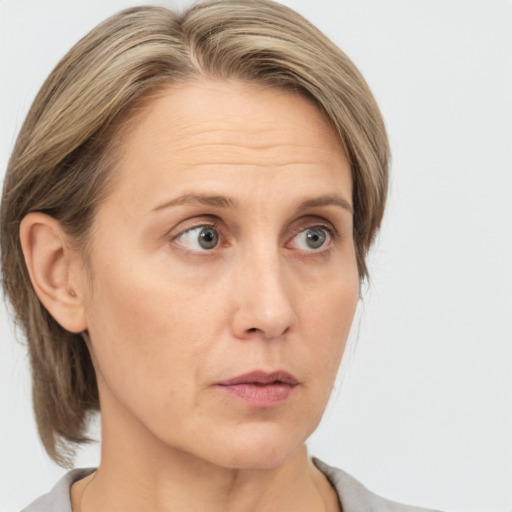 Neutral white adult female with medium  brown hair and grey eyes