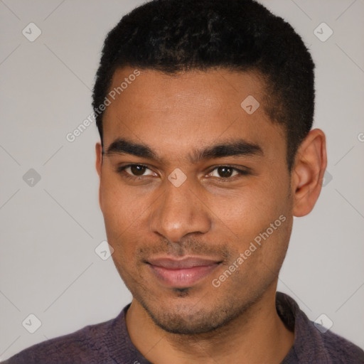 Joyful black young-adult male with short  black hair and brown eyes