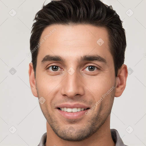 Joyful white young-adult male with short  brown hair and brown eyes